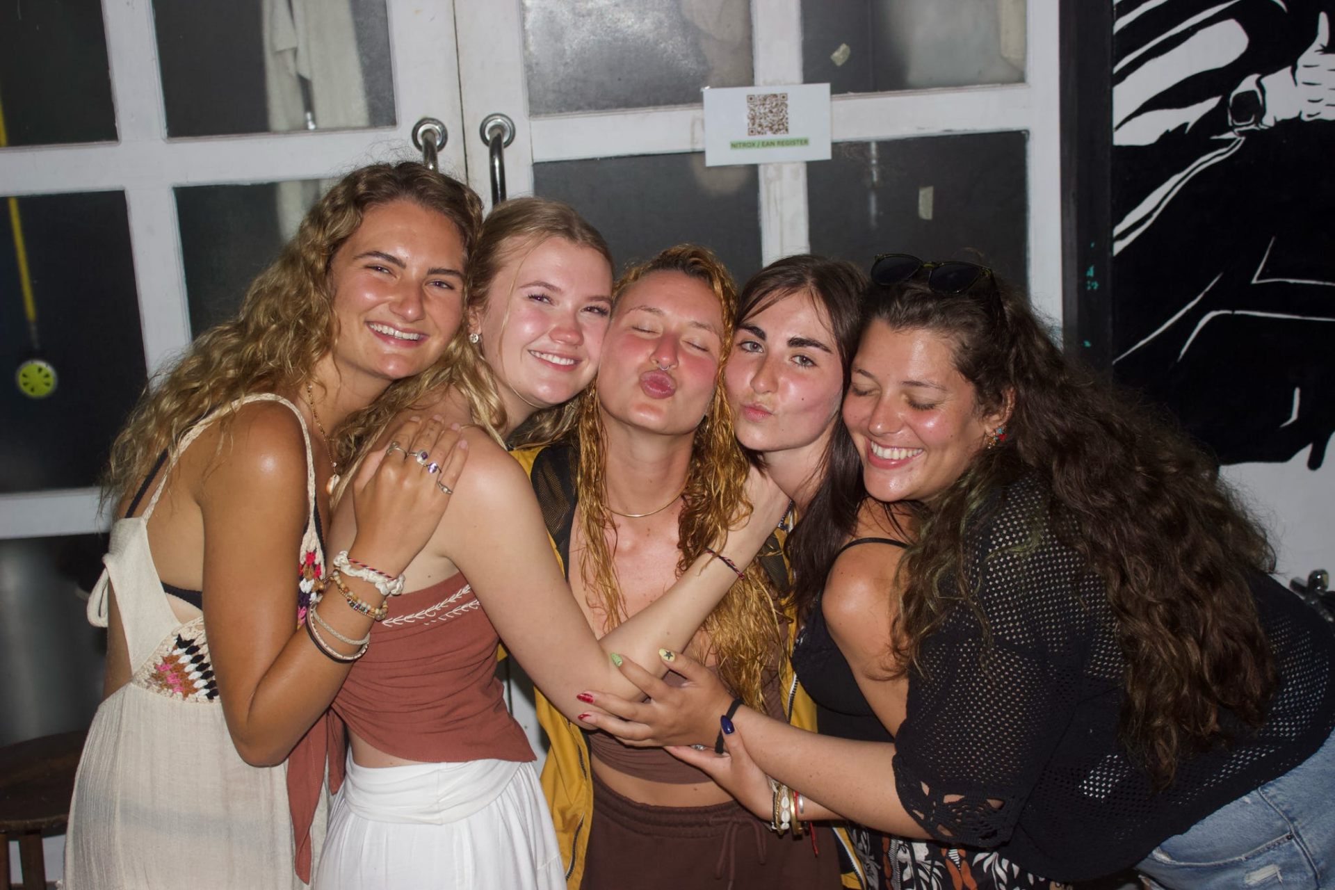 New friends laughing on a rooftop
